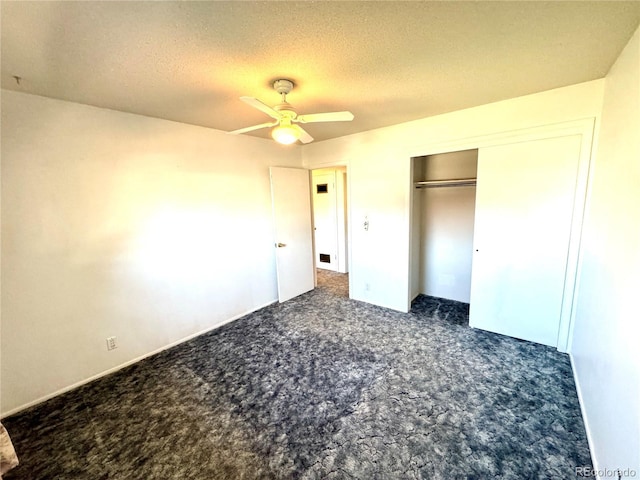 3498 Corbett Ln, Colorado Springs, CO 80907 - unfurnished bedroom featuring carpet floors, a textured ceiling, a closet, and a ceiling fan