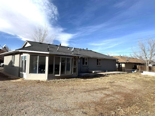 back of house with a patio and a sunroom