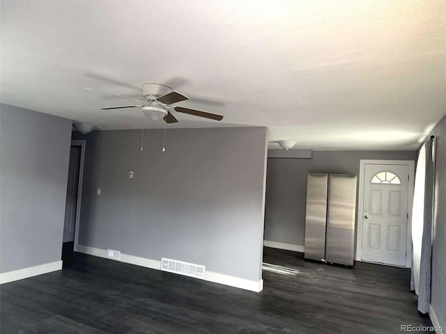 unfurnished room with ceiling fan and dark hardwood / wood-style floors