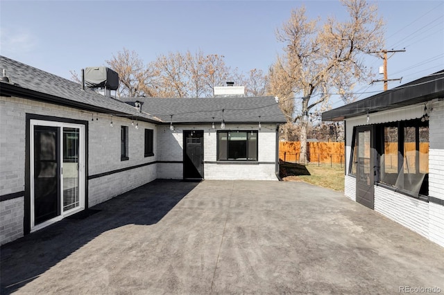 view of patio featuring fence