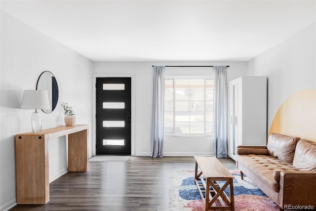 living area with baseboards and dark wood-style floors