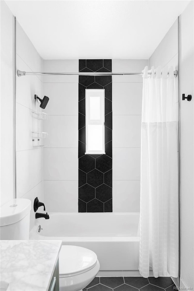 full bath featuring tile patterned flooring, shower / tub combo with curtain, toilet, and vanity