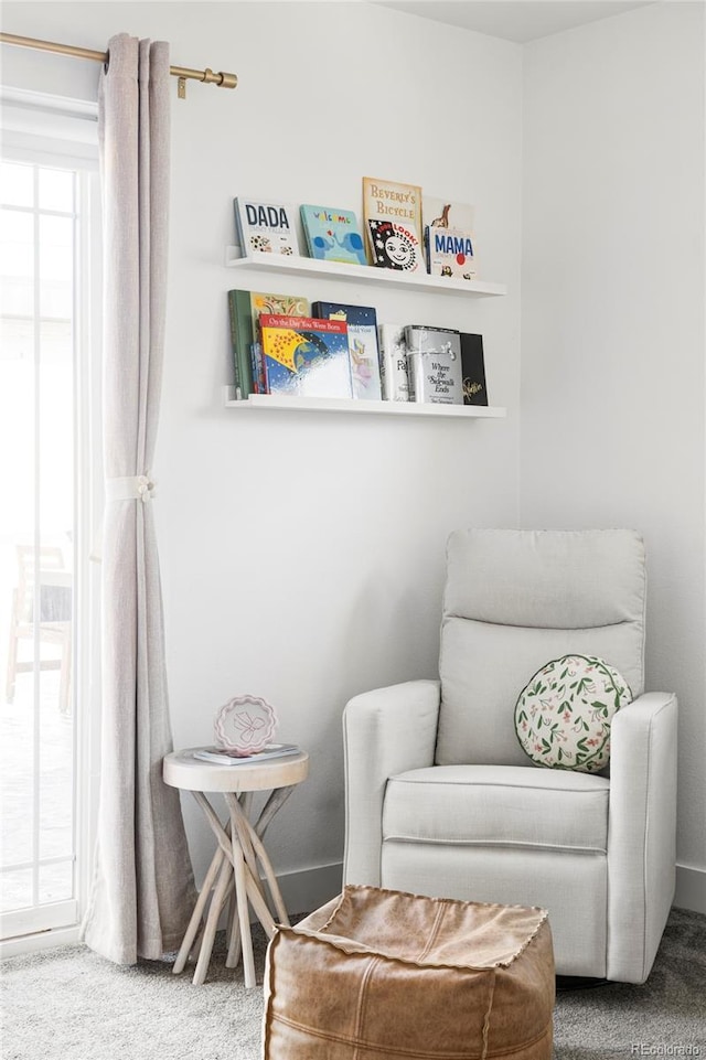 sitting room featuring carpet flooring