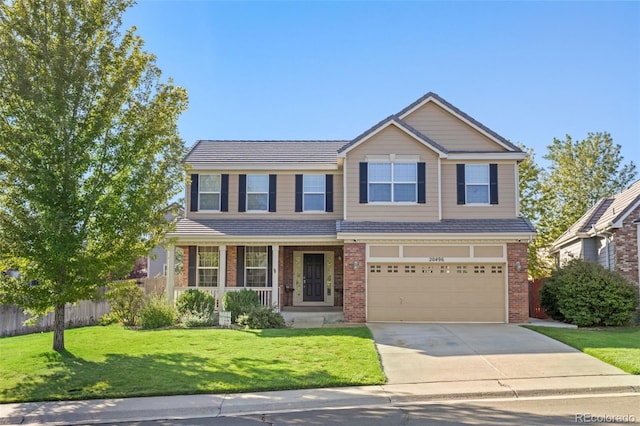 view of front of house featuring a garage and a front lawn