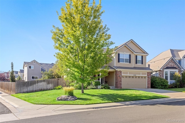 view of front of house featuring a front yard and a garage