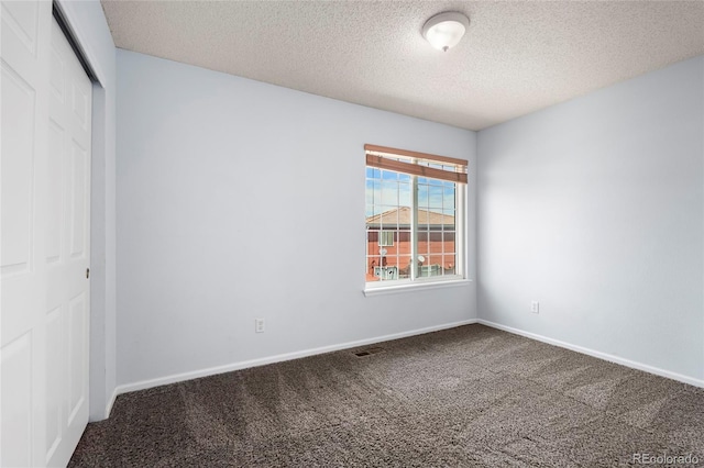 4184 Netherland St, Denver, CO 80249 - unfurnished bedroom with carpet floors, a closet, a textured ceiling, and baseboards