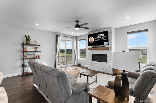 living room featuring a fireplace, ceiling fan, plenty of natural light, recessed lighting, and baseboards