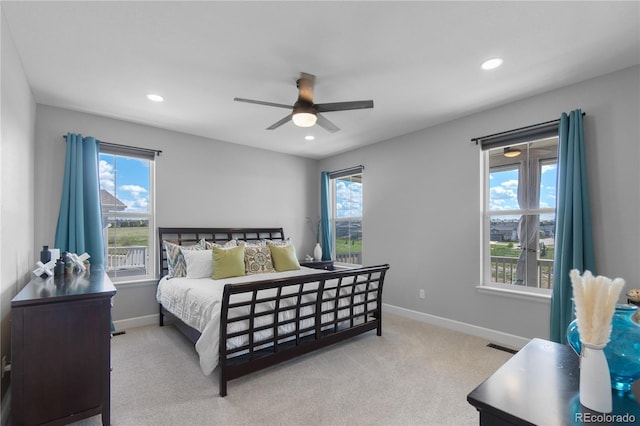 bedroom featuring multiple windows, recessed lighting, baseboards, and carpet floors