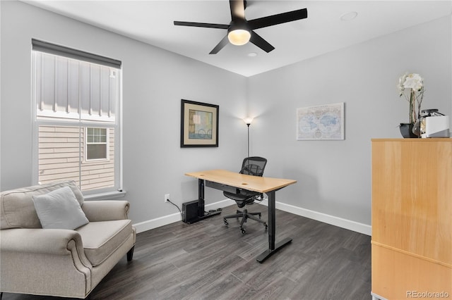 office area with a ceiling fan, dark wood-style floors, and baseboards