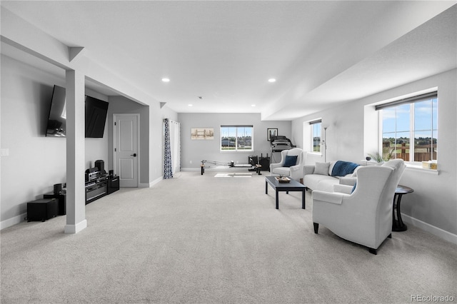 living room with light carpet, baseboards, and recessed lighting