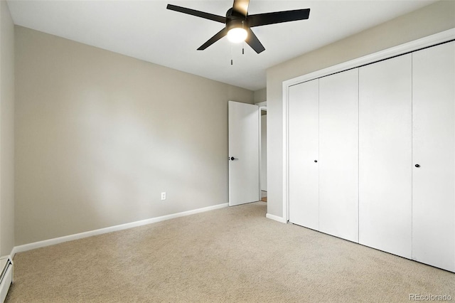 1092 E 16th Ave, Broomfield, CO 80020 - unfurnished bedroom with carpet floors, a closet, ceiling fan, and a baseboard heating unit