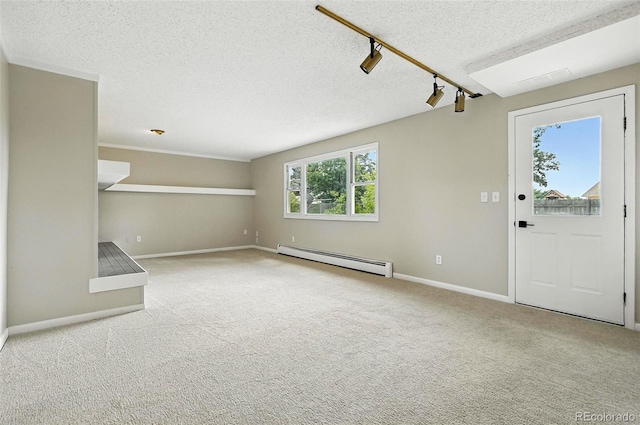 1092 E 16th Ave, Broomfield, CO 80020 - unfurnished living room featuring a baseboard heating unit, a textured ceiling, and carpet floors
