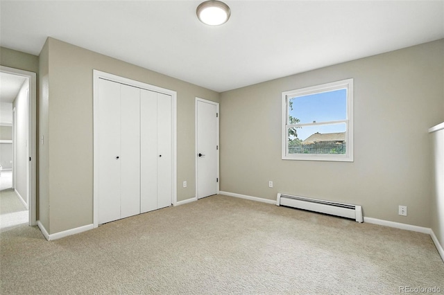 1092 E 16th Ave, Broomfield, CO 80020 - unfurnished bedroom featuring baseboard heating, carpet flooring, and a closet