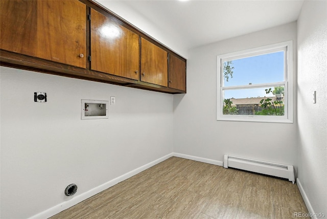 1092 E 16th Ave, Broomfield, CO 80020 - laundry room with baseboard heating, cabinet space, light wood finished floors, electric dryer hookup, and hookup for a washing machine