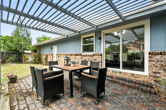 1092 E 16th Ave, Broomfield, CO 80020 - fenced backyard with outdoor dining area, a pergola, and a patio