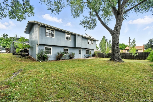 1092 E 16th Ave, Broomfield, CO 80020 - back of property with a fenced backyard and a patio