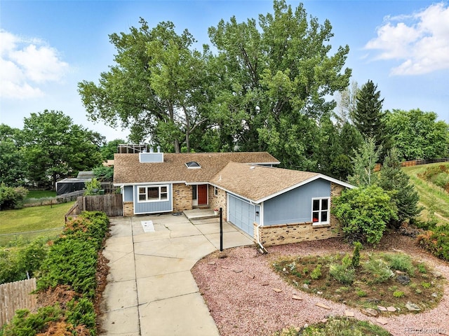 1092 E 16th Ave, Broomfield, CO 80020 - view of front of home featuring brick siding, concrete driveway, roof with shingles, and an attached garage