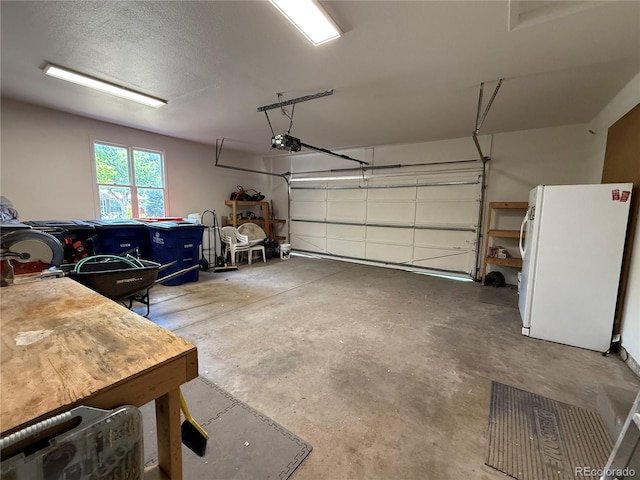 1092 E 16th Ave, Broomfield, CO 80020 - garage featuring freestanding refrigerator and a garage door opener