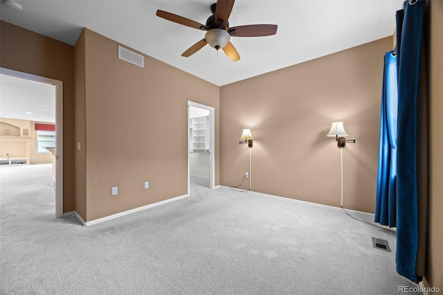 unfurnished bedroom featuring visible vents, carpet flooring, and baseboards
