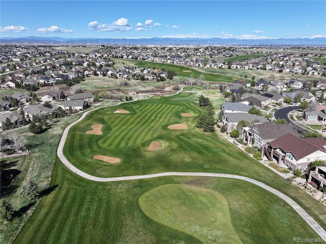 bird's eye view with a mountain view, golf course view, and a residential view