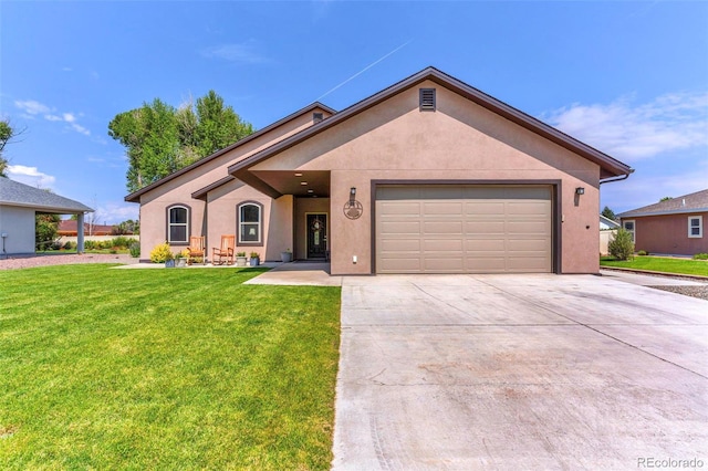 view of front of house featuring a garage and a front lawn