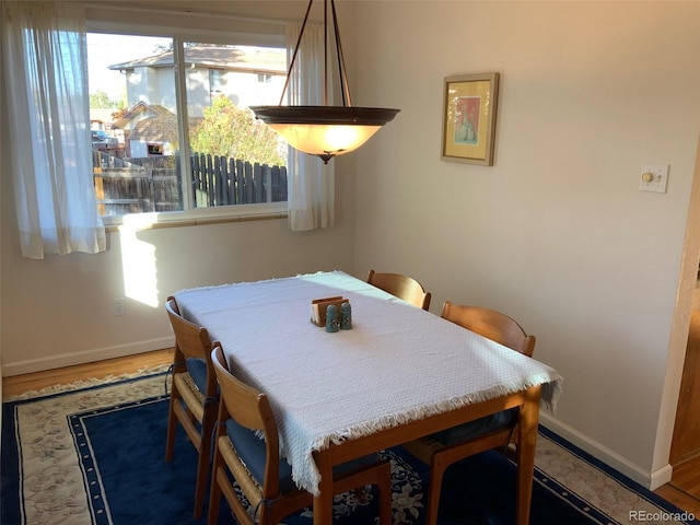 dining space featuring hardwood / wood-style floors