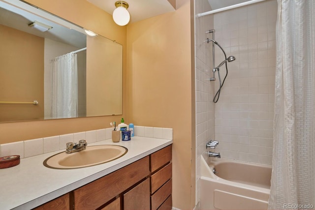 bathroom featuring shower / tub combo with curtain and vanity