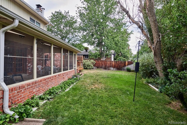 view of yard with a sunroom