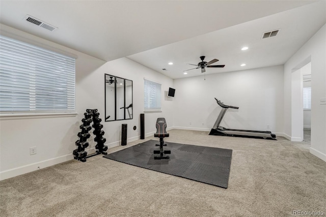 workout area featuring light carpet, ceiling fan, visible vents, and recessed lighting