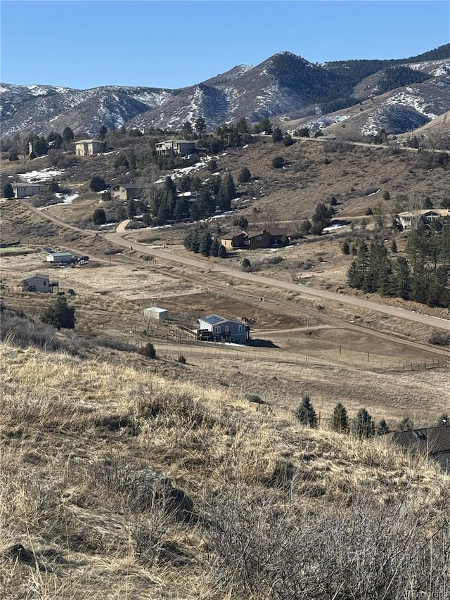 mountain view featuring a rural view