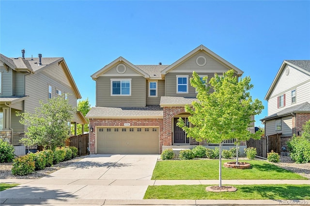 25486 E 4th Pl, Aurora, CO 80018 - view of front of property featuring brick siding, an attached garage, concrete driveway, and a shingled roof