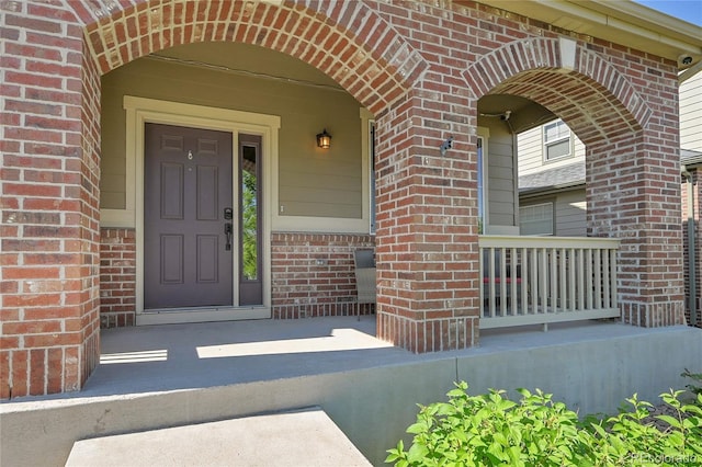 25486 E 4th Pl, Aurora, CO 80018 - property entrance with brick siding and a porch