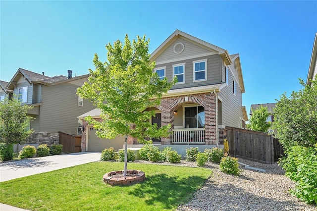 25486 E 4th Pl, Aurora, CO 80018 - view of front of home with brick siding, concrete driveway, and a porch