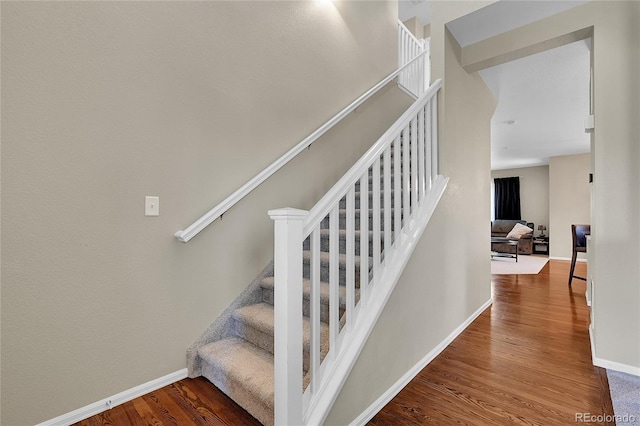 25486 E 4th Pl, Aurora, CO 80018 - stairs featuring wood finished floors and baseboards