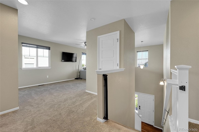 25486 E 4th Pl, Aurora, CO 80018 - corridor featuring carpet floors and an upstairs landing