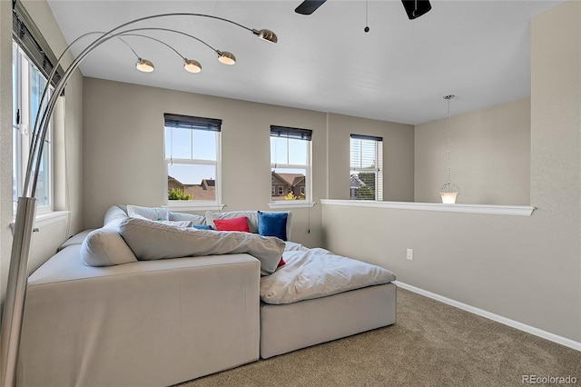 25486 E 4th Pl, Aurora, CO 80018 - carpeted living area featuring plenty of natural light and ceiling fan