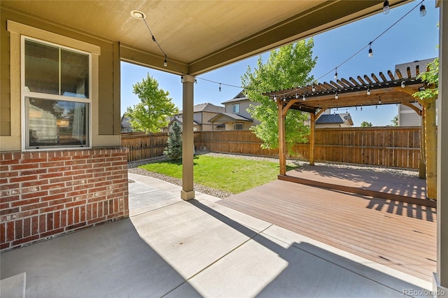 25486 E 4th Pl, Aurora, CO 80018 - fenced backyard with a pergola, a wooden deck, and a patio
