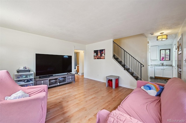 3350 W 94th Ave, Westminster, CO 80031 - living room with stairs and light wood-style flooring