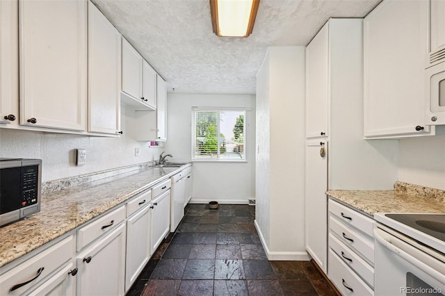3350 W 94th Ave, Westminster, CO 80031 - kitchen featuring stone tile flooring, white cabinets, white appliances, and light stone countertops