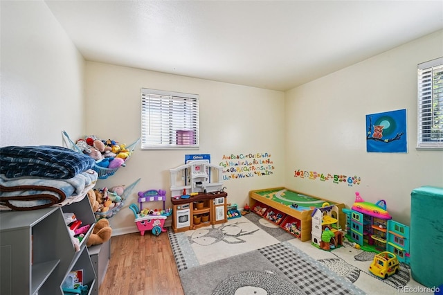 3350 W 94th Ave, Westminster, CO 80031 - game room featuring healthy amount of natural light and wood finished floors
