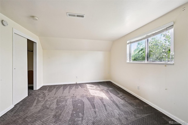 3350 W 94th Ave, Westminster, CO 80031 - unfurnished bedroom featuring dark colored carpet and lofted ceiling