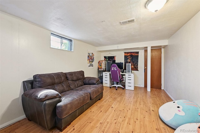 3350 W 94th Ave, Westminster, CO 80031 - living area with light wood-style floors, a textured ceiling, and an office area