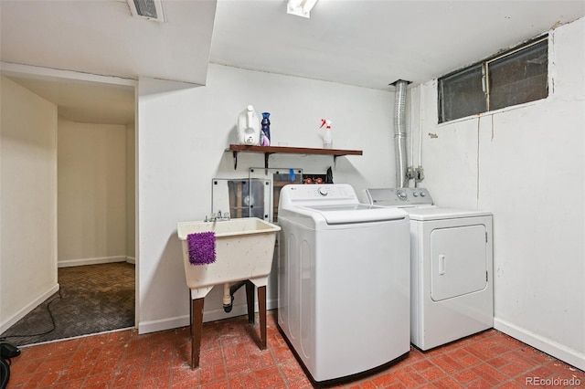 3350 W 94th Ave, Westminster, CO 80031 - laundry area featuring washing machine and dryer and brick patterned floors
