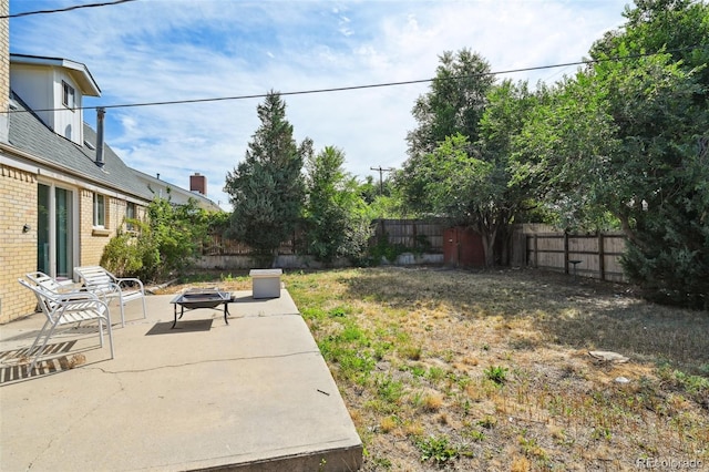3350 W 94th Ave, Westminster, CO 80031 - fenced backyard featuring an outdoor fire pit and a patio