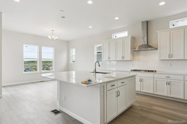 4716 Twelve Oaks Way, Castle Rock, CO 80104 - kitchen with wall chimney exhaust hood, a sink, healthy amount of natural light, and recessed lighting
