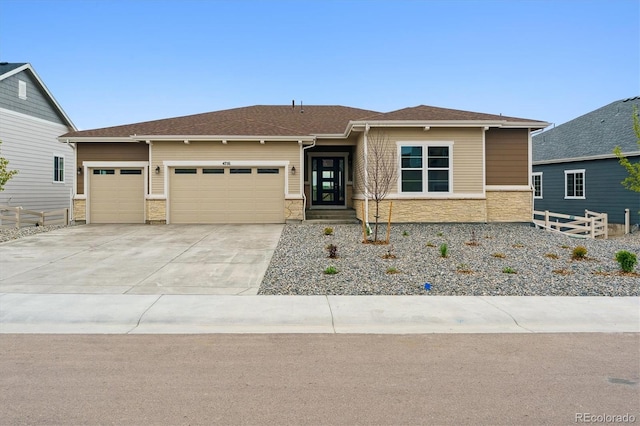 4716 Twelve Oaks Way, Castle Rock, CO 80104 - view of front facade with an attached garage, stone siding, and concrete driveway