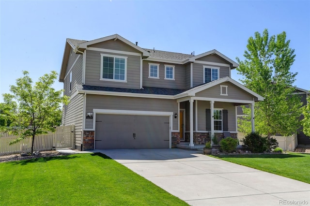 craftsman-style house with a porch, an attached garage, driveway, stone siding, and roof with shingles