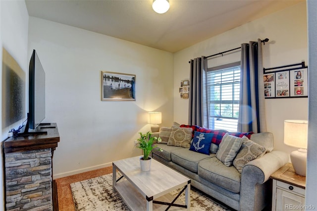 living area with light colored carpet and baseboards