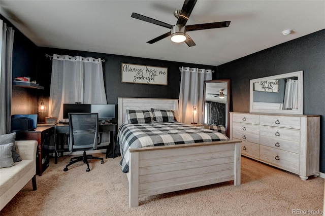 carpeted bedroom featuring a ceiling fan and a desk