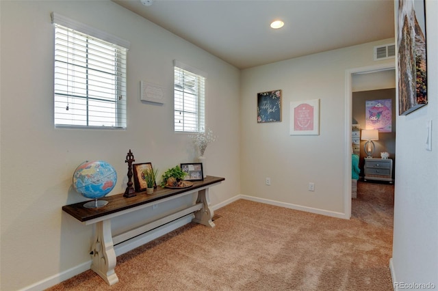 hallway featuring carpet, baseboards, and recessed lighting